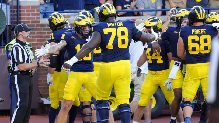 Michigan celebrates the touchdown by running back Donovan Edwards (7) during the 1st quarter against Fresno State at Michigan Stadium at Michigan Stadium in Ann Arbor on Saturday, Aug. 31, 2024.