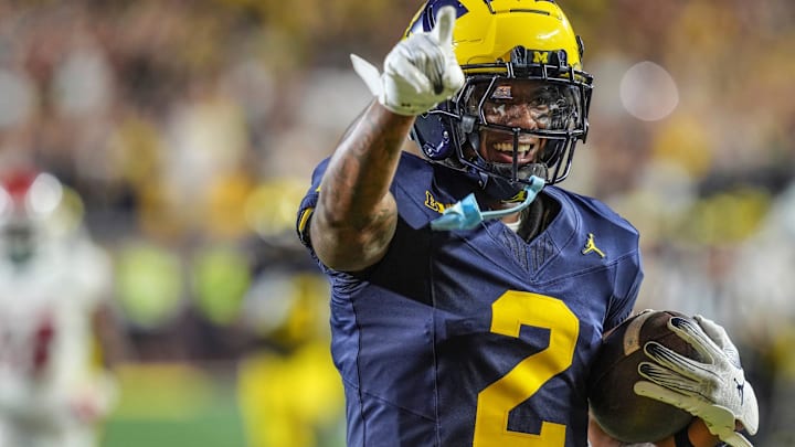 Michigan defensive back Will Johnson (2) celebrates after returning an interception for a touchdown against Fresno State during the second half at Michigan Stadium in Ann Arbor on Saturday, Aug. 31, 2024.