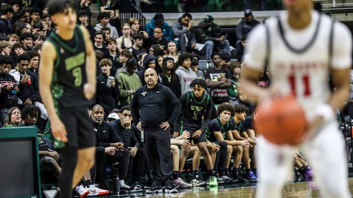 Ann Arbor Huron coach Mo Kasham looks on late in the fourth quarter of a loss against Orchard Lake St. Mary during the Michigan High School Athletic Association boys basketball Division 1 semifinals at Breslin Center in East Lansing on Friday, March 15, 2024.