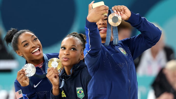 Simone Biles, Rebeca Andrade and Jordan Chiles celebrate their floor medals. 