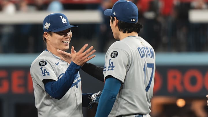 Dodgers pitcher Yoshinobu Yamamoto, left, delivered another dominant postseason performance on Saturday.