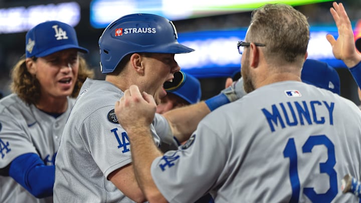 Dodgers catcher Will Smith, center, hit the go-ahead home run in the 11th inning. Dodgers catcher Will Smith, center, hit the go-ahead home run in the 11th inning.