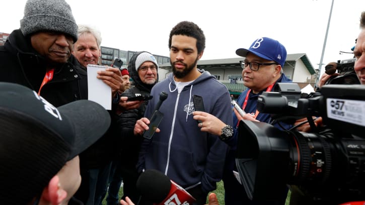 Caleb Williams talks with reporters in Detroit after an appearance at a Special Olympics flag football clinic.