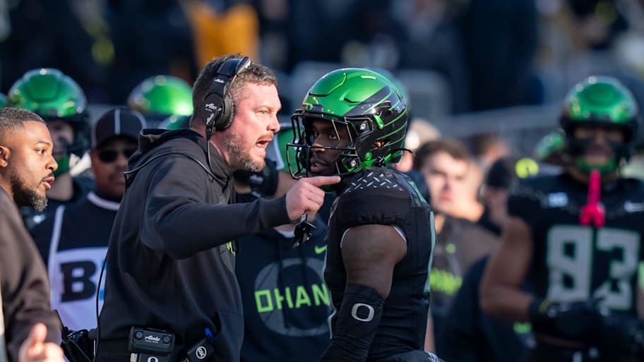 Oregon head coach Dan Lanning yells at Oregon wide receiver Malik Benson 