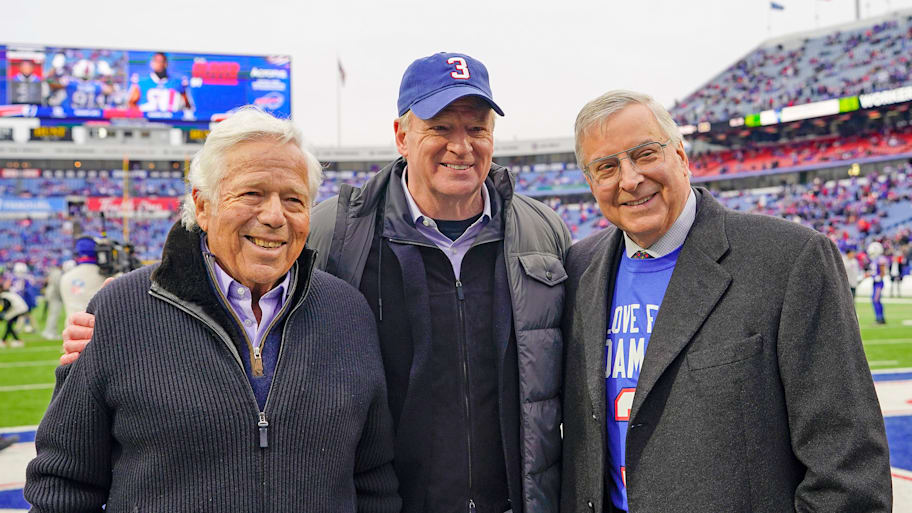 Roger Goodell stands with Robert Kraft and Terry Pegula with the field behind them