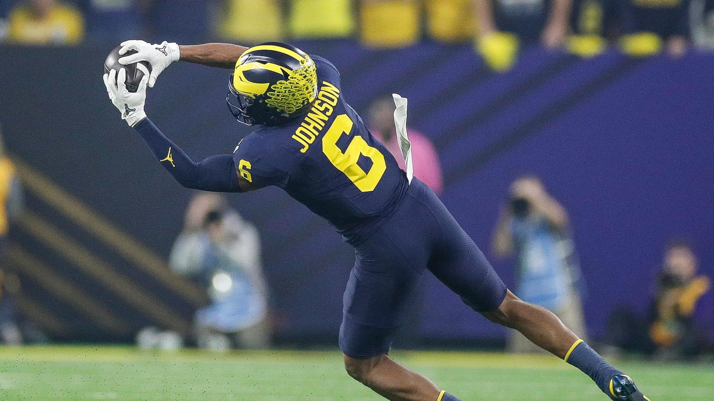 Michigan wide receiver Cornelius Johnson makes a catch against Washington.