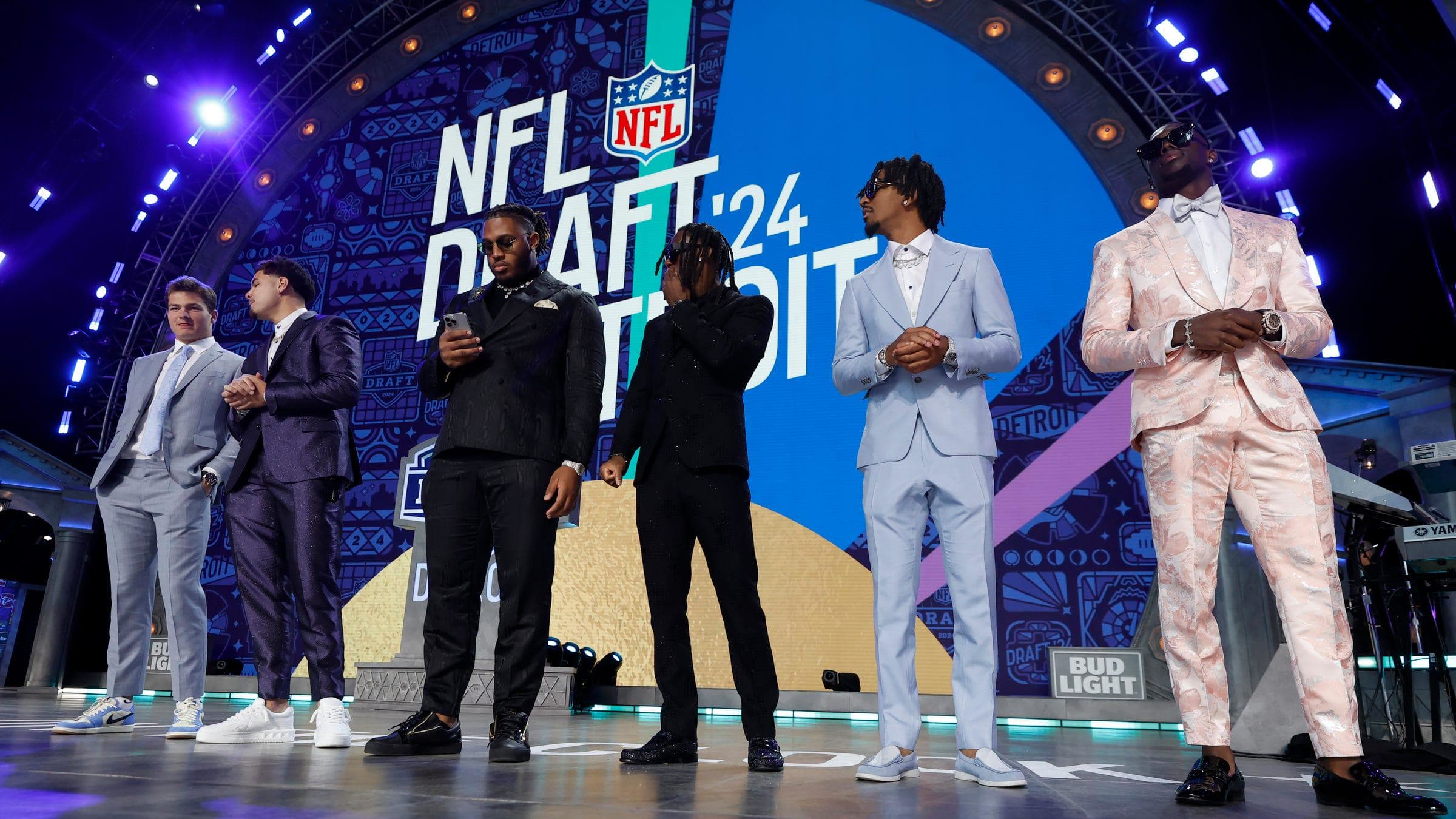 Rookies stand on the stage during the 2024 NFL Draft.