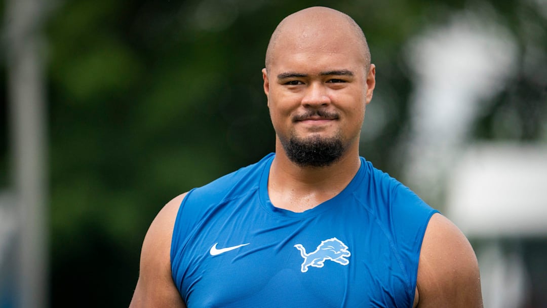 Newly drafted Lion Giovanni Manu walks off the field after he works out at practice with fellow offensive lineman on Tuesday, July 30, 2024 at the Lions practice facility in Allen Park.