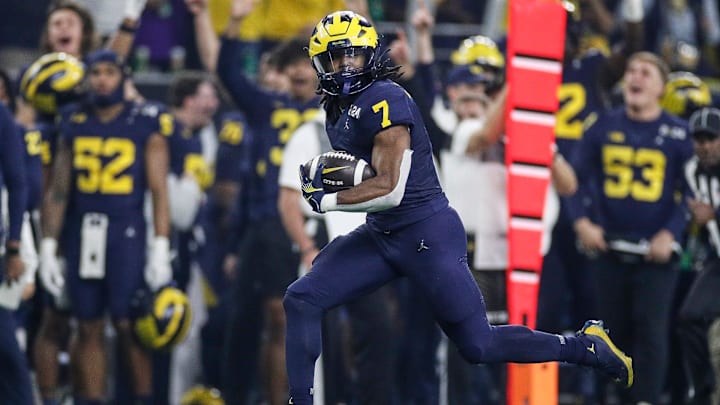 Michigan running back Donovan Edwards runs for a touchdown against Washington during the first half of the national championship game at NRG Stadium in Houston, Texas on Monday, Jan. 8, 2024.