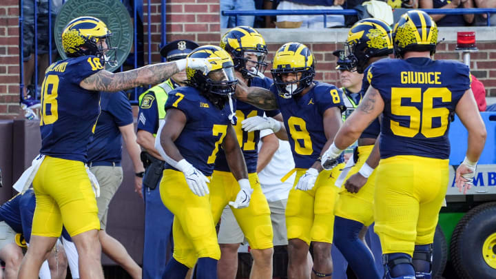 Michigan celebrates the touchdown by running back Donovan Edwards (7) during the 1st quarter against Fresno State at Michigan Stadium in Ann Arbor on Saturday, Aug. 31, 2024.