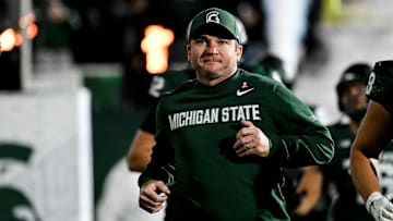 Michigan State's head coach Jonathan Smith runs onto the field with the team before the gam against Michigan Saturday, Oct. 25, 2025, at Spartan Stadium in East Lansing.