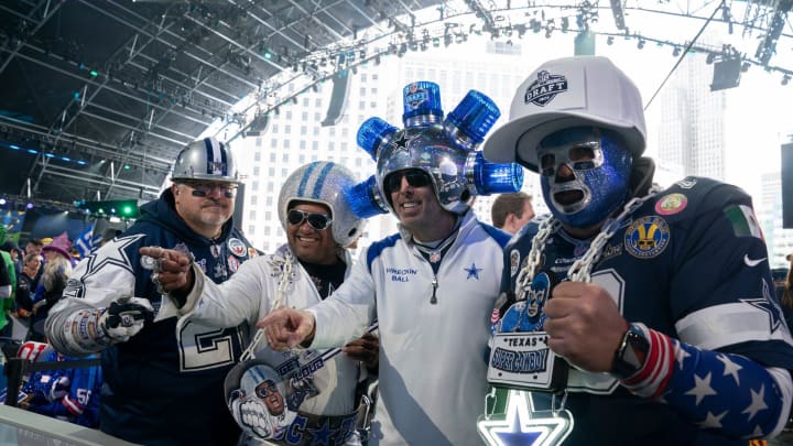 Dallas Cowboys fans pose in the main theater on Thursday, April 25, 2024 for the first day of the