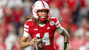 Nebraska quarterback TJ Lateef scrambles for a 9-yard gain against Akron.