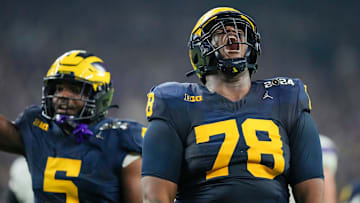 Michigan defensive lineman Kenneth Grant celebrates a sack on Washington quarterback Michael Penix Jr. during the College Football Playoff national championship game against Washington at NRG Stadium in Houston, Texas, on Monday, Jan. 8, 2024.