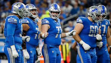 Detroit Lions center Frank Ragnow (77), center, fist bumps the offensive line before a play against Atlanta Falcons during the first half at Ford Field in Detroit on Sunday, Sept. 24, 2023.