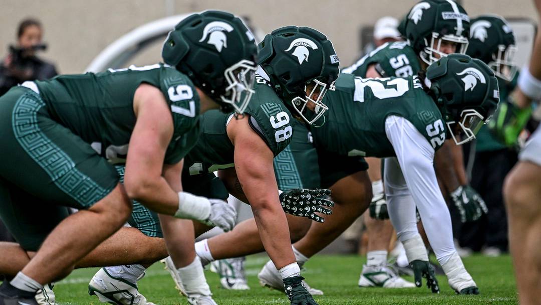 Michigan State's Derrick Simmons, center, lines up with the defense during the football Spring Showcase on Saturday, April 18, 2026, at Spartan Stadium in East Lansing. Michigan State's Derrick Simmons, center, lines up with the defense during the football Spring Showcase on Saturday, April 18, 2026, at Spartan Stadium in East Lansing.