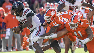 Nov 30, 2024; Clemson, South Carolina, USA; South Carolina quarterback LaNorris Sellers (16) runs by Clemson defense. Mandatory Credit: Ken Ruinard-Imagn Images