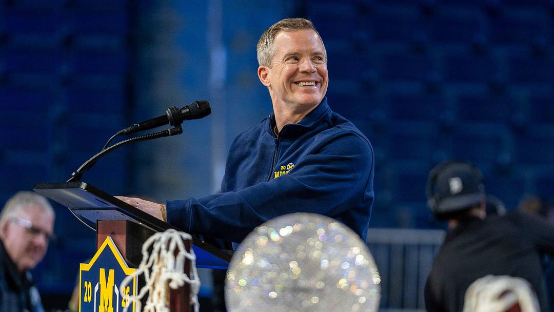 Michigan head coach Dusty May smiles at the podium during a celebration honoring the Wolverines’ NCAA men’s basketball national championship at Crisler Center in Ann Arbor on Saturday, April 11, 2026.