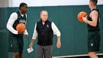 Michigan State's coach Tom Izzo, left, talks with Coen Carr, left, and Denham Wojcik during the first day of basketball practice on Monday, Sept. 22, 2025, at the Breslin Center in East Lansing.