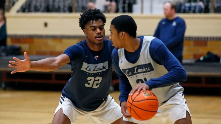 La Lumiere junior Jalen Haralson (32) defends teammate Ace Bucker during an open practice Thursday, Nov. 9, 2023, at the La Porte Civic Auditorium.