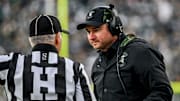 Michigan State's head coach Jonathan Smith talks to a referee during the first quarter in the game against Penn State on Saturday, Nov. 15, 2025, at Spartan Stadium in East Lansing.