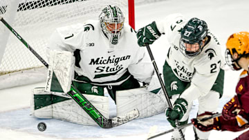 Michigan State's Trey Augustine, left, guards the goal against Minnesota during the first period on Saturday, Jan. 25, 2025, at Munn Arena in East Lansing.