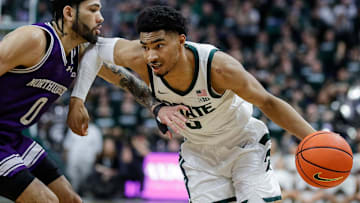 Michigan State guard Jaden Akins (3) dribbles against Northwestern guard Boo Buie (0) during the