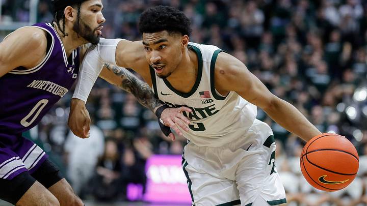 Michigan State guard Jaden Akins (3) dribbles against Northwestern guard Boo Buie (0) during the