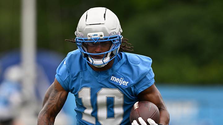 Detroit Lions running back Isiah Pacheco (10) runs the ball