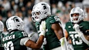 Michigan State's Jalen Thompson, right, celebrates his tackle for a safety against Western Michigan during the third quarter on Friday, Aug. 29, 2025, in East Lansing.