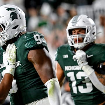 Michigan State's Jalen Thompson, right, celebrates his tackle for a safety against Western Michigan during the third quarter on Friday, Aug. 29, 2025, in East Lansing.