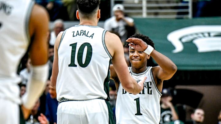 Michigan State's Jeremy Fears Jr., right, celebrates with Szymon Zapala after Zapala scored and drew a Florida Atlantic foul during the second half on Saturday, Dec. 21, 2024, in East Lansing.
