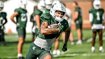 Michigan State's Braylon Collier runs with the ball during football practice on Monday, Aug. 11, 2025, in East Lansing.