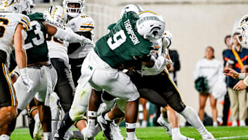 Michigan State's Jalen Thompson, left, tackles Western Michigan's Jalen Buckley for a safety during the third quarter on Friday, Aug. 29, 2025, in East Lansing.