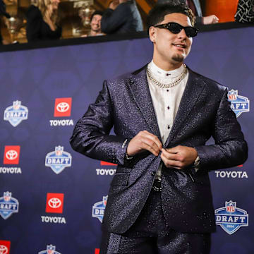 NFL Draft prospect Laiatu Latu walks the red carpet for NFL Draft day at the Fox Theatre in Detroit on Thursday, April 25, 2024.