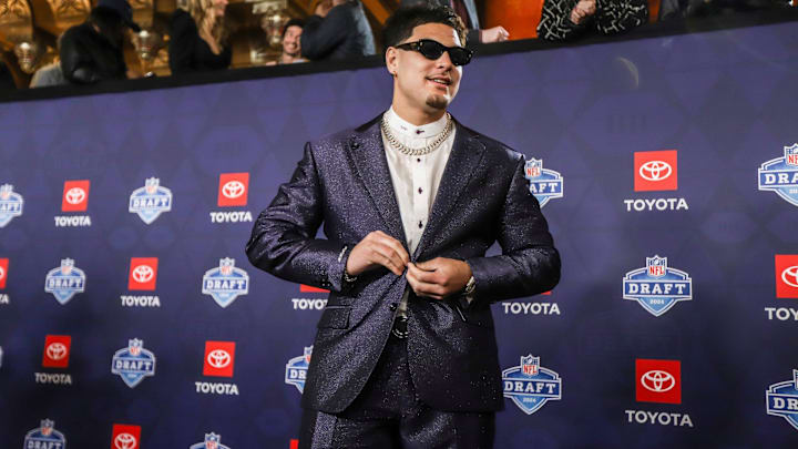 NFL Draft prospect Laiatu Latu walks the red carpet for NFL Draft day at the Fox Theatre in Detroit on Thursday, April 25, 2024.