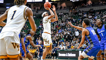 Wayne Memorial's Carlos Medlock Jr. shoots against Flint Carman-Ainsworth during the second quarter in the Division 1 state semifinal on Friday, March 14, 2025, at the Breslin Center in East Lansing.