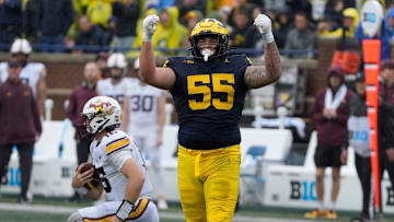 CAROLINA PANTHERS: Michigan defensive lineman Mason Graham celebrates after sacking Minnesota quarterback Max Brosmer, in the background, during first-half action between Michigan and Minnesota at Michigan Stadium in Ann Arbor on Saturday, Sept. 28, 2024.