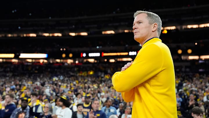 Michigan head coach Dusty May looks on from the court ahead of the NCAA national championship game against Connecticut at Lucas Oil Stadium in Indianapolis on Monday, April 6, 2026.