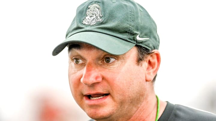 Michigan State's head coach Jonathan Smith talks with the team during camp on Monday, Aug. 5, 2024, at the indoor practice facility in East Lansing.