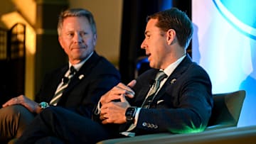 Michigan State University Athletic Director J Batt, right, speaks on stage with MSU President Kevin Guskiewicz during a panel discussion hosted by the Lansing Economic Club on Thursday, Sept. 11, 2025, at the Kellogg Center in East Lansing.