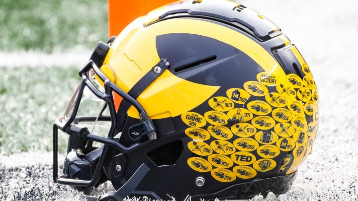 Michigan running back Blake Corum's helmet sits on the turf during warmups before the Ohio State game at Michigan Stadium in Ann Arbor on Saturday, Nov. 25, 2023.