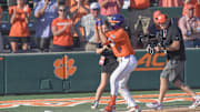 Clemson catcher Jacob Jarrell (9) hits a home run against University of Louisville during the bottom of the fifth inning at Doug Kingsmore Stadum in Clemson, S.C. Friday, April 18, 2025. The home run broke up a no-hitter and helped the Tigers win 2-1.