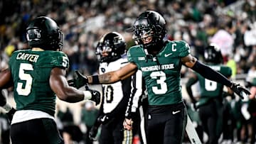 Michigan State's Montorie Foster Jr., right, celebrates with Nathan Carter, left, after Carter's touchdown against Purdue during the second quarter on Friday, Nov. 22, 2024, at Spartan Stadium in East Lansing.