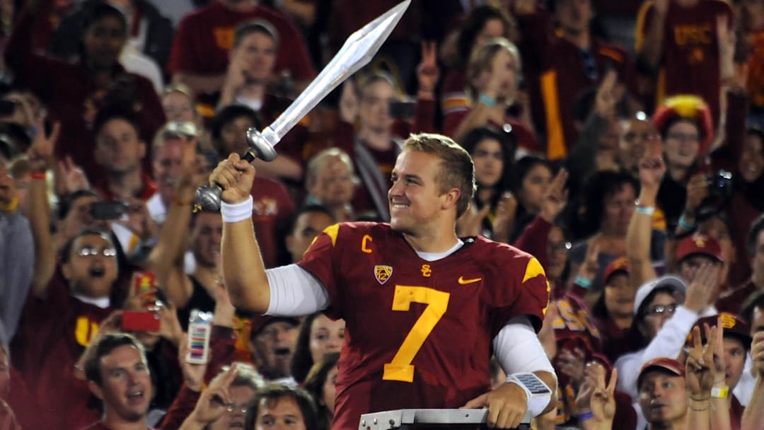 October 20, 2012; Los Angeles, CA, USA;  Southern California quarterback Matt Barkley (7) leads the band after the game against the Colorado Buffaloes at the Los Angeles Coliseum.  Southern California won 50-6. Mandatory Credit: Jayne Kamin-Oncea-Imagn Images