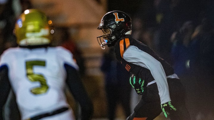 Lakeland (7) Cormani McClain runs back an interception against Osceola during first half action in Lakeland Fl  Friday December 2,2022.Ernst Peters/The Ledger

120222 Ep Preps 9 News