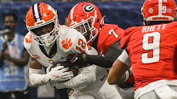 Clemson Tigers wide receiver Bryant Wesco Jr. (12) is tackled by Georgia Bulldogs defensive back Daniel Harris (7) 