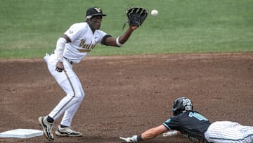 May 31, 2024; Clemson, SC, USA; Vanderbilt University sophomore RJ Austin (42) tags out Coastal Carolina junior Sam Antonacci (10) trying to steal second in the first inning during the NCAA Clemson Regional baseball game at Doug Kingsmore Stadium. Mandatory Credit: Ken Ruinard-Imagn Images