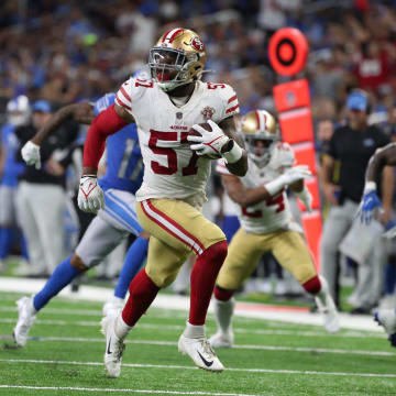 San Francisco 49ers linebacker Dre Greenlaw returns an interception back for a touchdown against the Detroit Lions on Sunday, Sept. 12, 2021 at Ford Field.