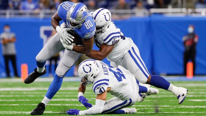 Former Colts defensive tackle Chris Williams brings down Darren Fells in a preseason game in 2021. Williams is now a Bear.